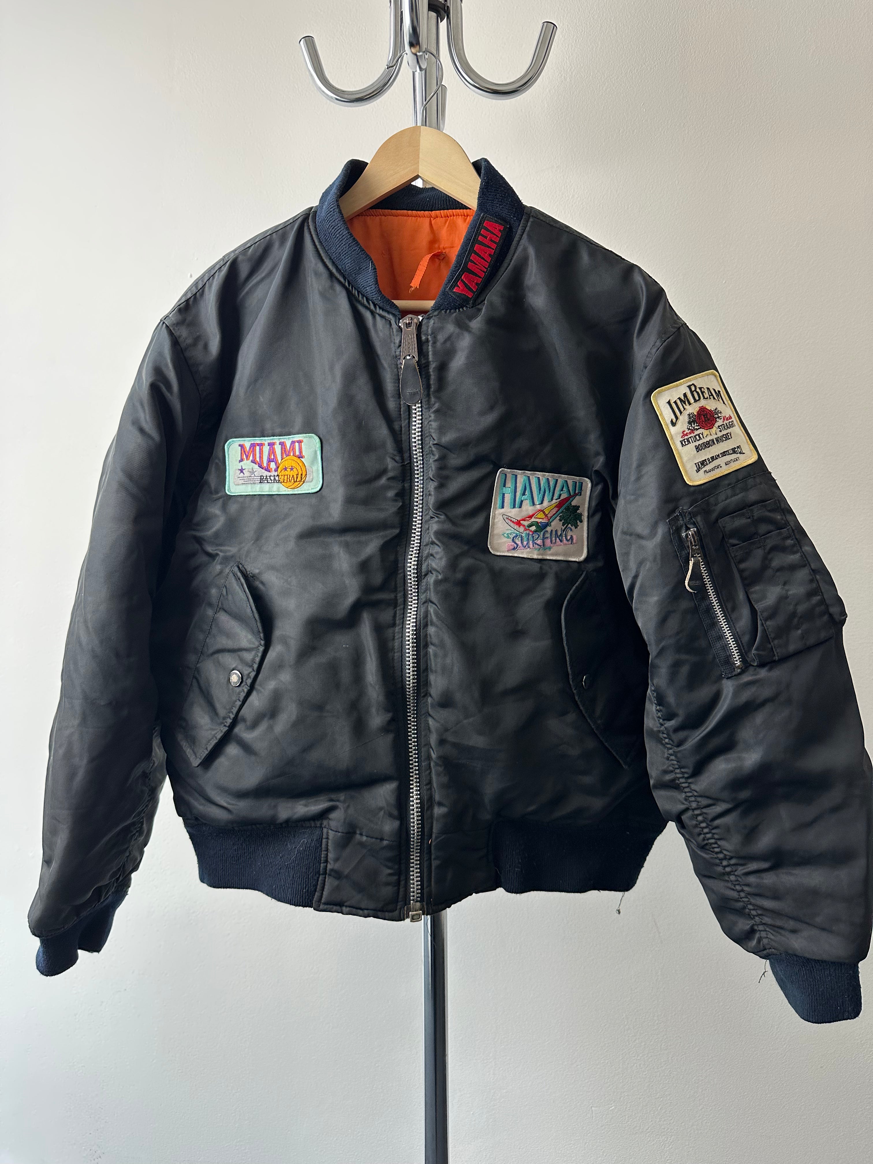 Vintage 1980s Alpha Industries MA-1 “Travel Patched” Bomber - size M/L