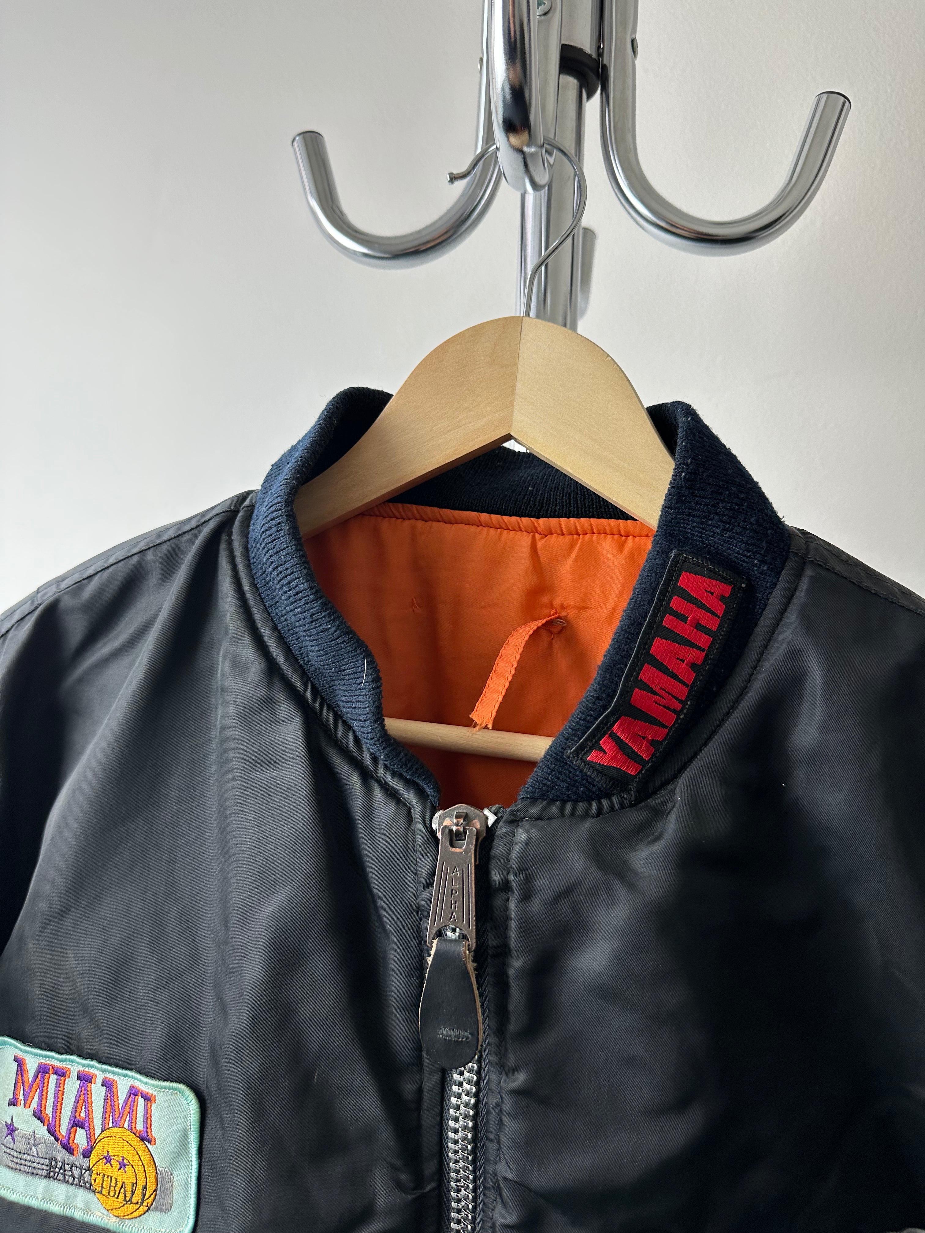 Vintage 1980s Alpha Industries MA-1 “Travel Patched” Bomber - size M/L