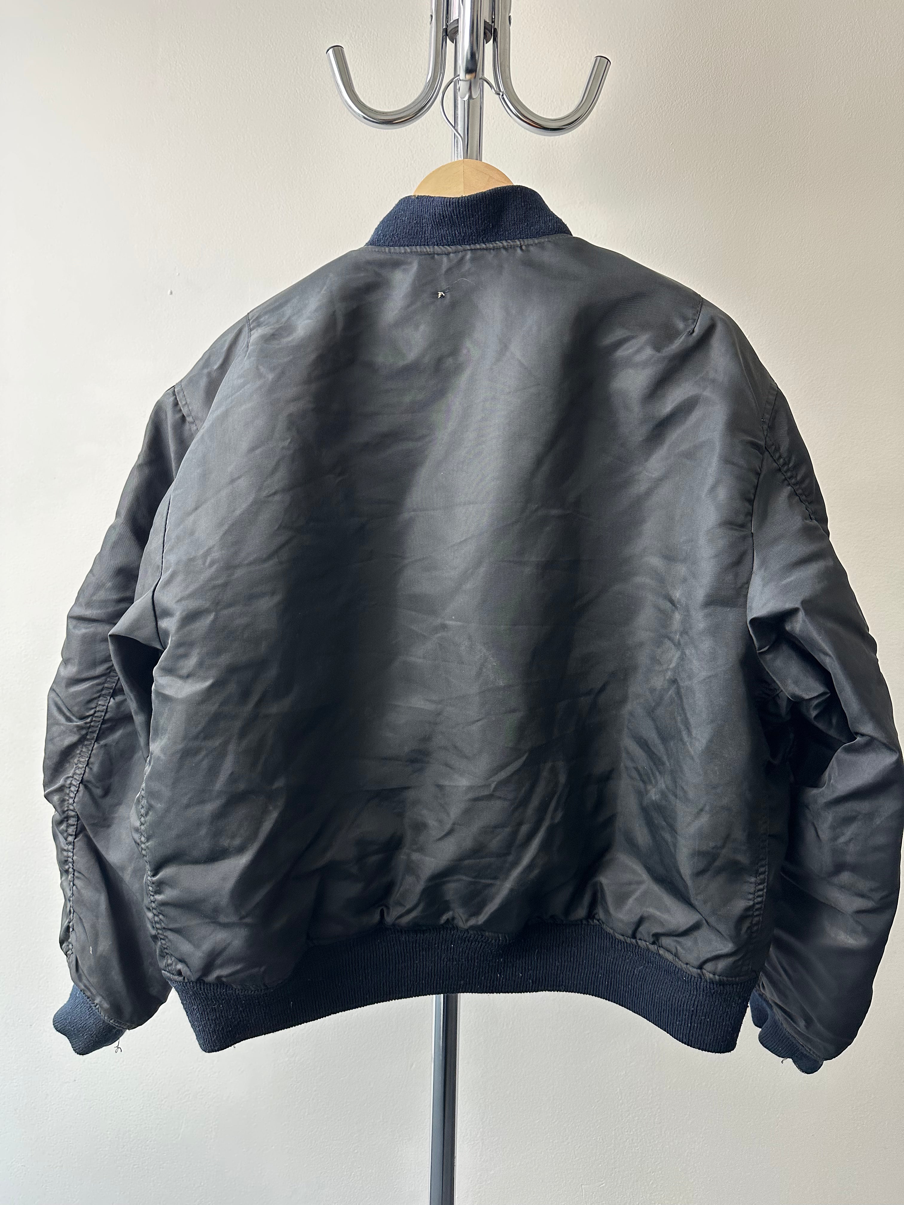 Vintage 1980s Alpha Industries MA-1 “Travel Patched” Bomber - size M/L