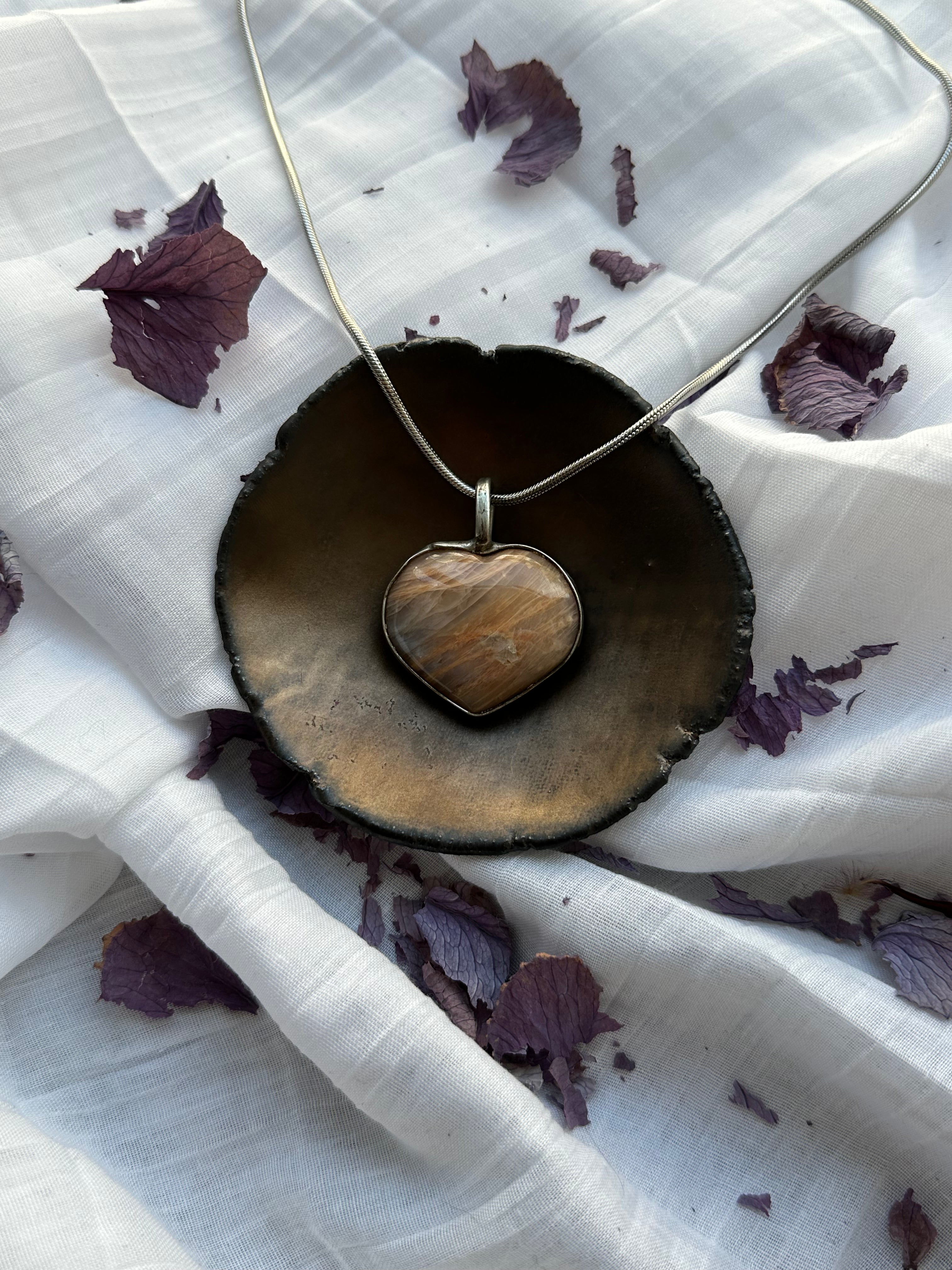“Earthbound Love” — Aragonite Pendant by Laura Řezaninová